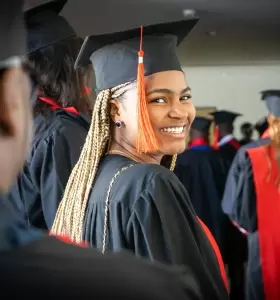 A young Black woman graduates from college